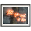 a neon sign that says all you need is love