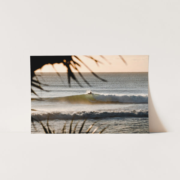 a picture of a surfer riding a wave