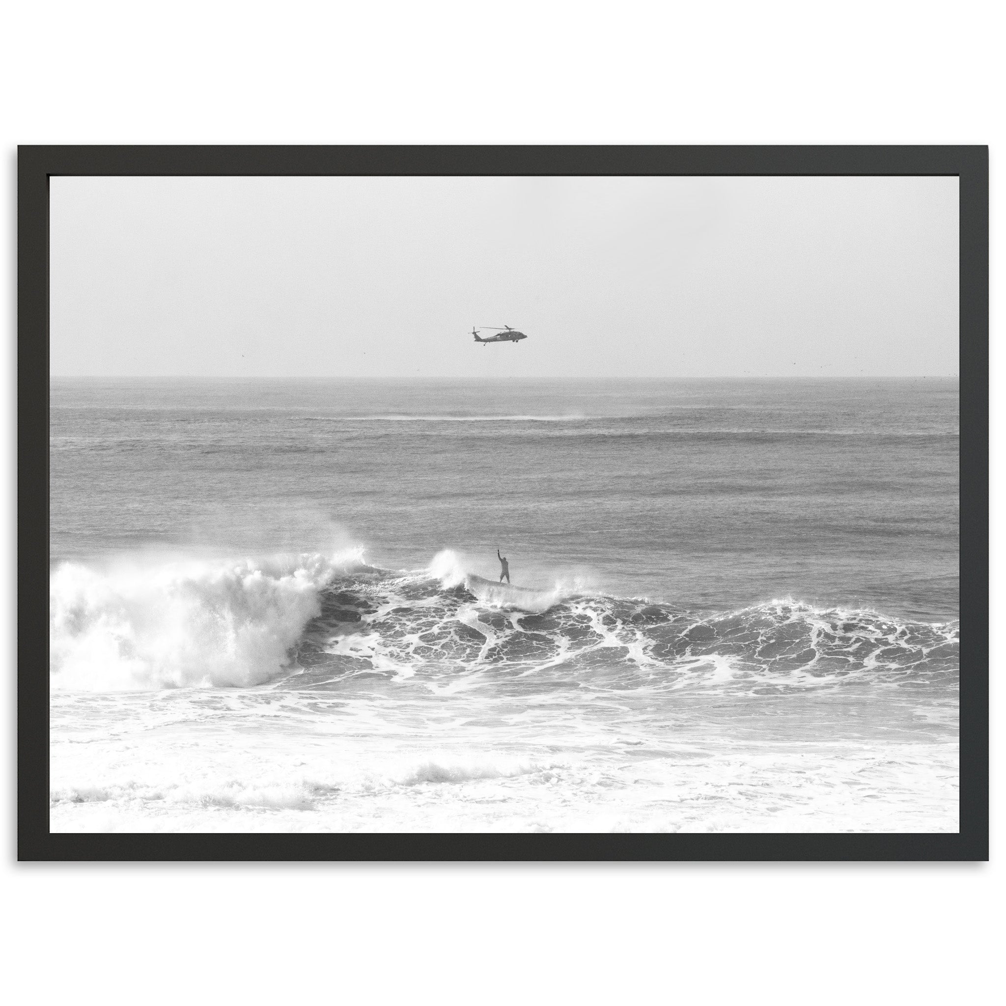 a black and white photo of a boat in the ocean