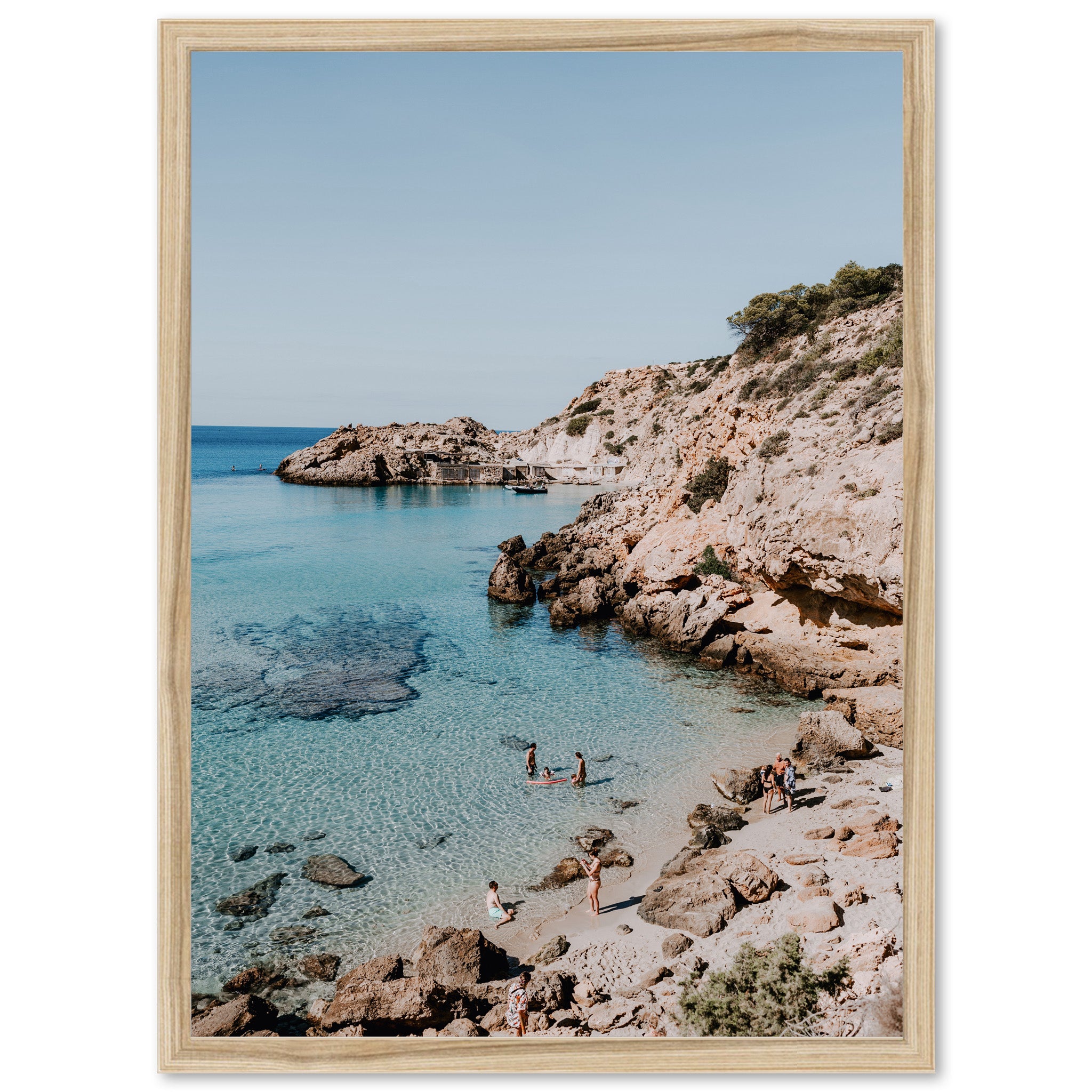 a picture of a beach with people swimming in the water