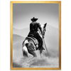 a black and white photo of a cowboy on a horse