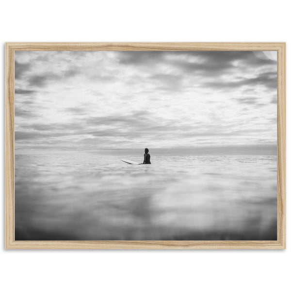 a black and white photo of a person on a surfboard