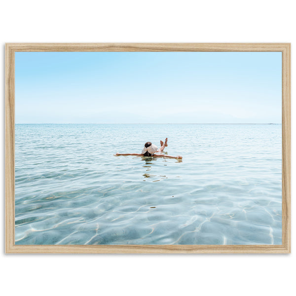 a person sitting on a surfboard in the water