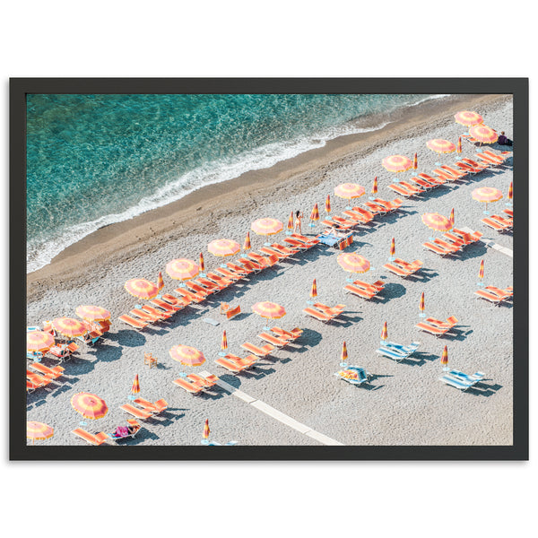 an aerial view of a beach with umbrellas and chairs