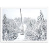 a ski lift in the middle of a snowy forest