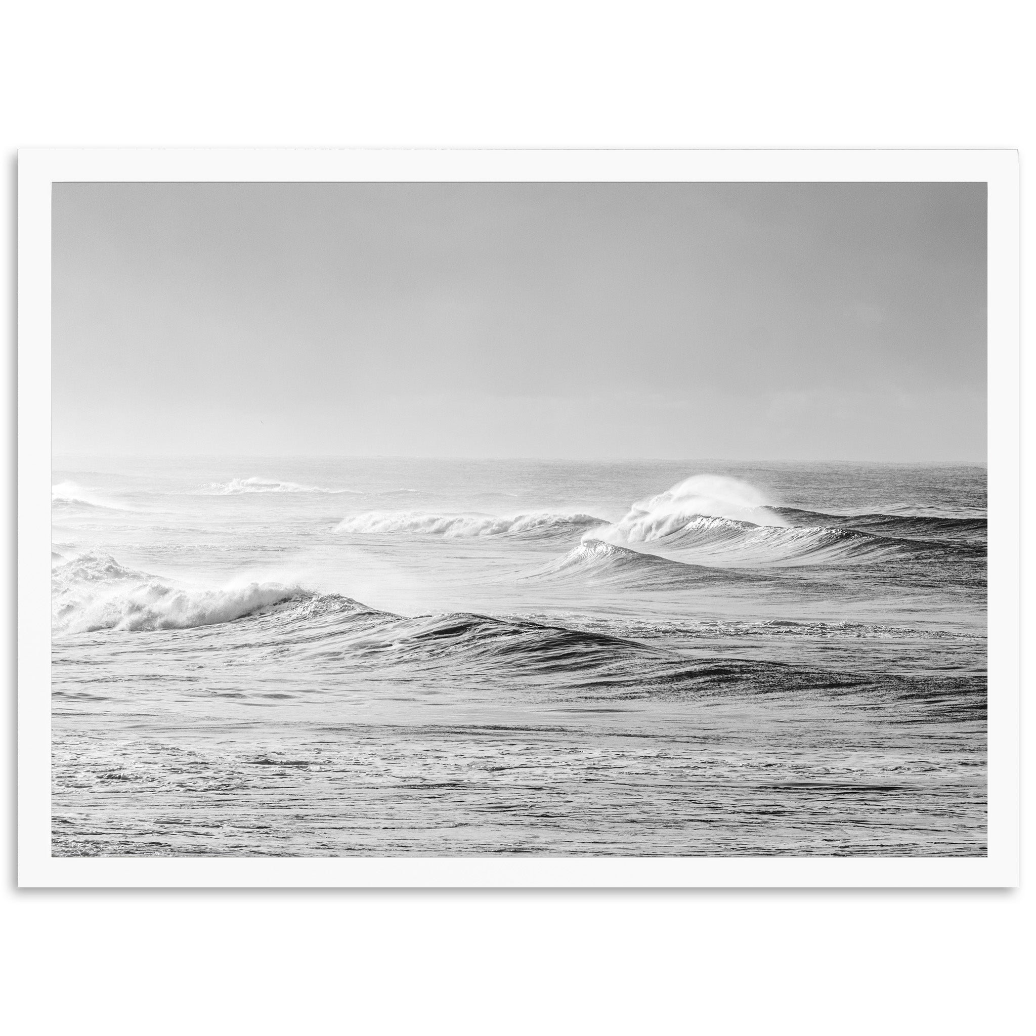 a black and white photo of waves in the ocean