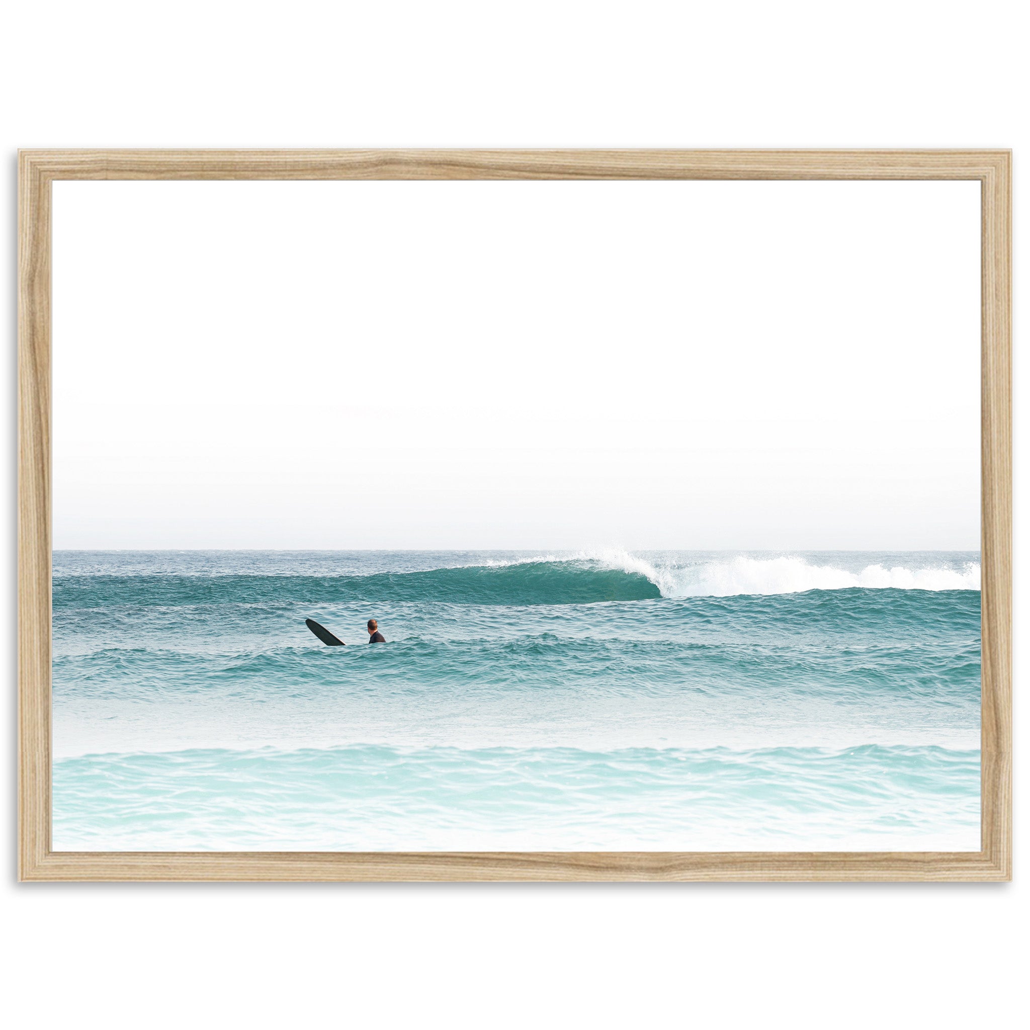 a man riding a surfboard on top of a wave in the ocean