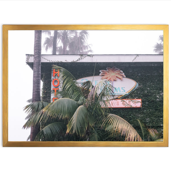 a picture of a palm tree and a neon sign