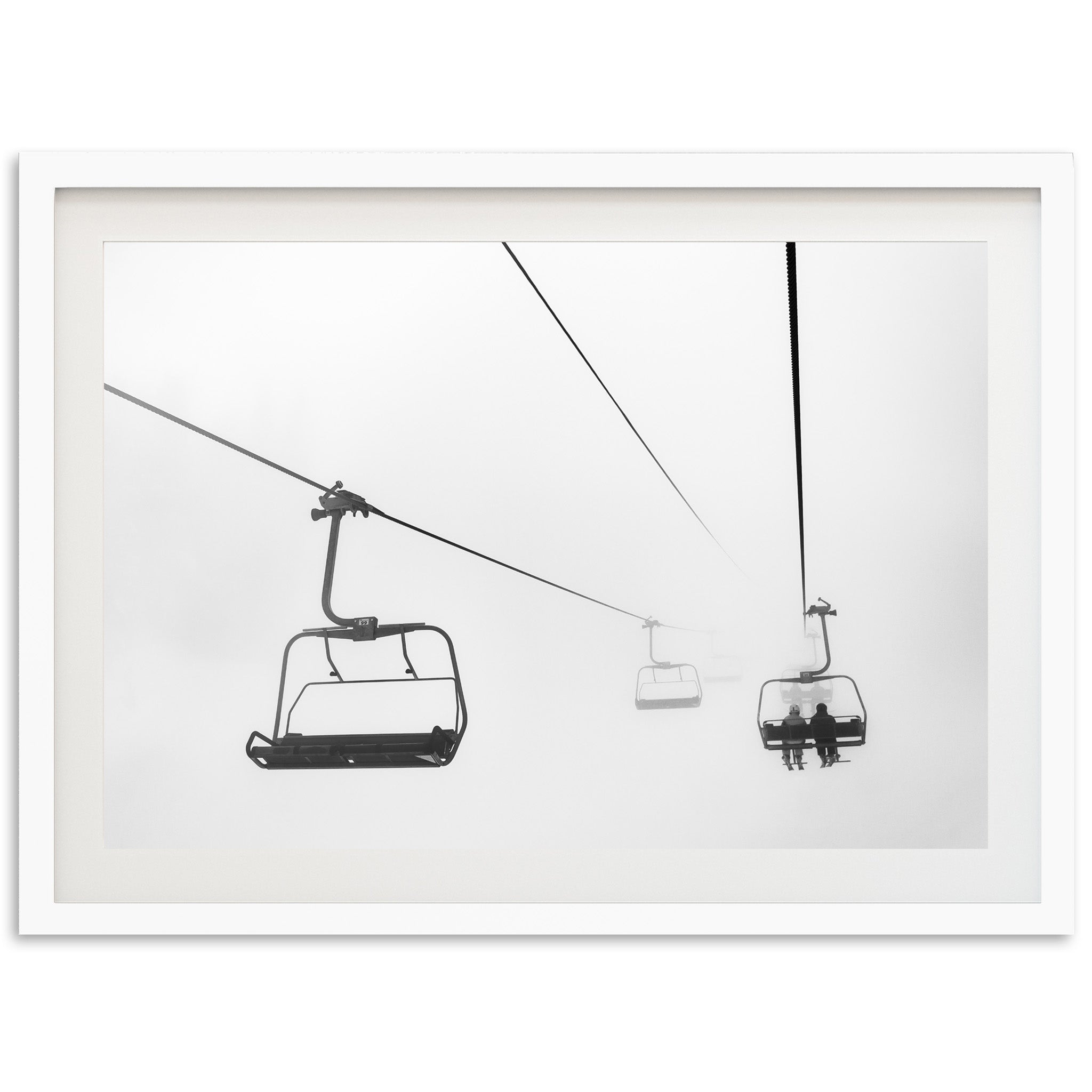 a black and white photo of a ski lift