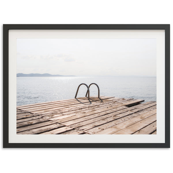 a picture of a pair of shoes on a dock