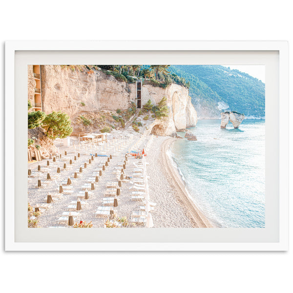 a picture of a beach with tables and chairs