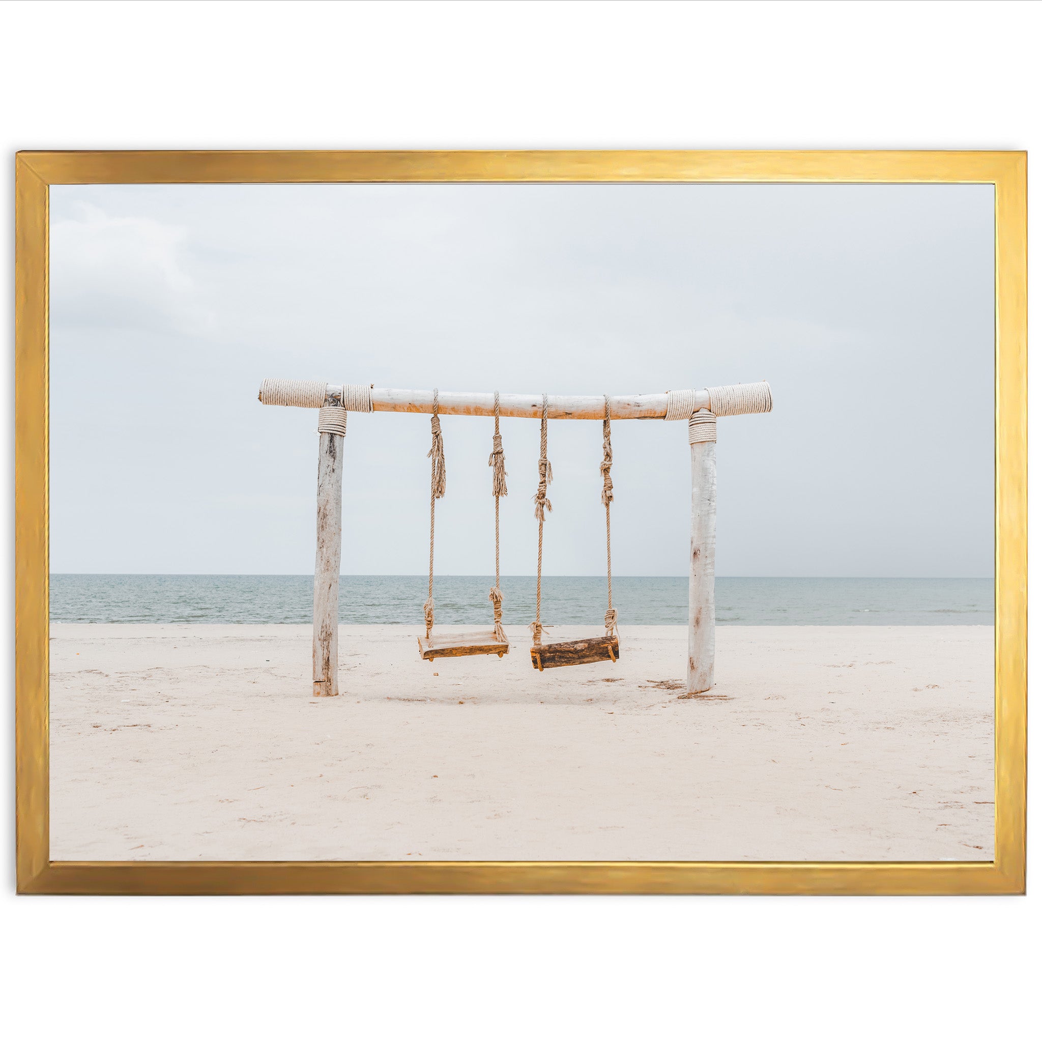 a picture of a swing set on a beach