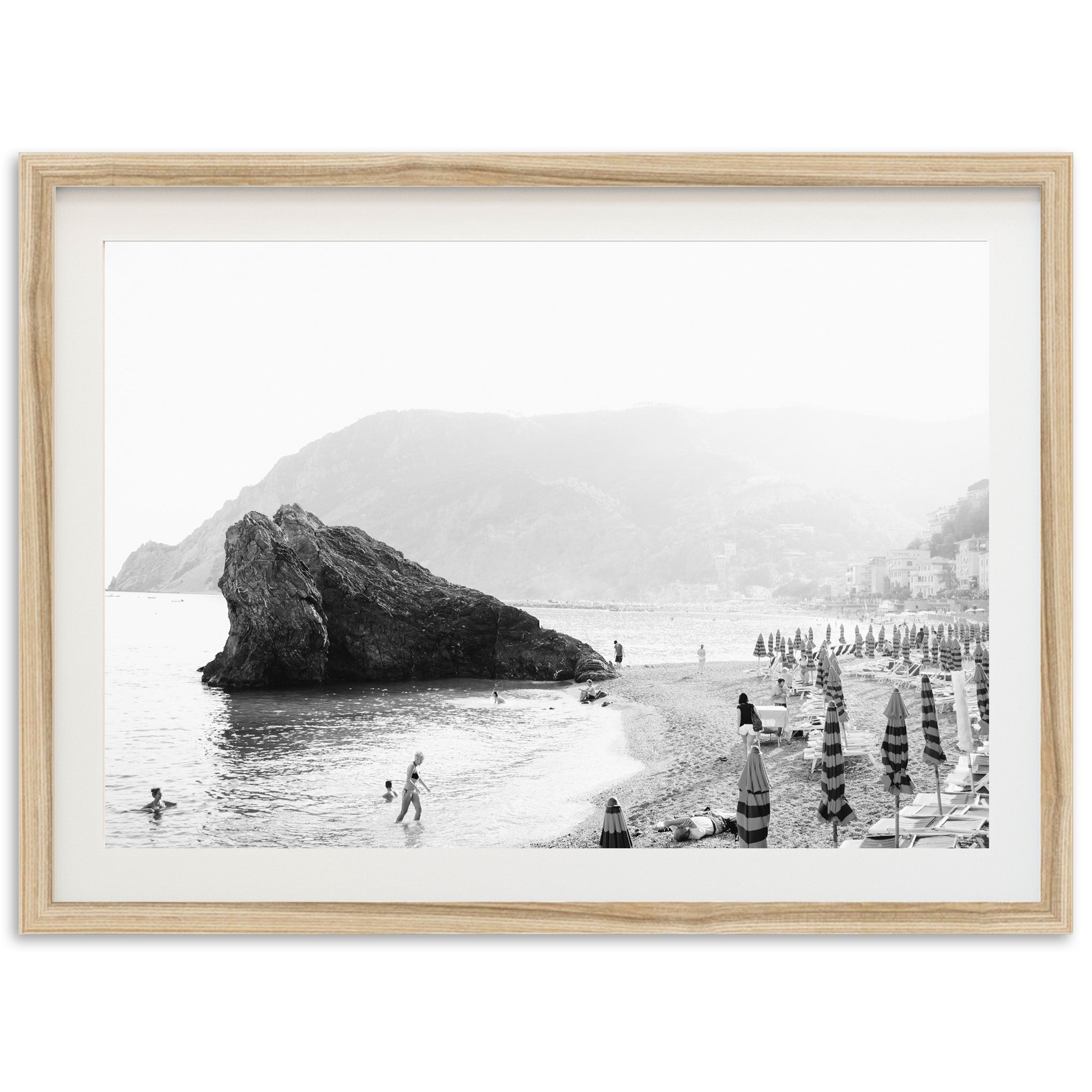 a black and white photo of people on a beach