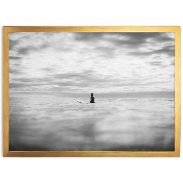 a black and white photo of a person on a surfboard