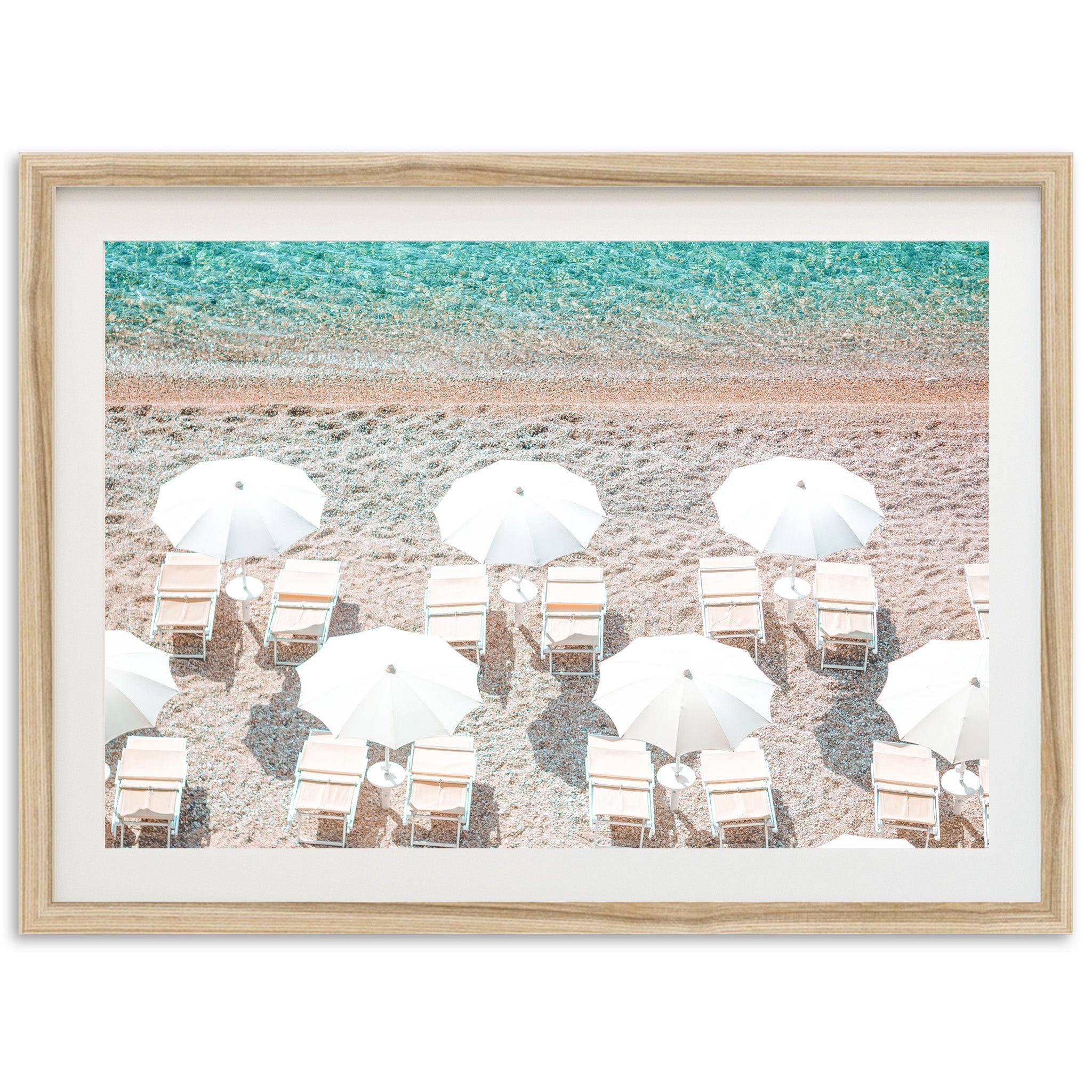 a picture of a beach with chairs and umbrellas