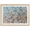 a picture of a water surface in a wooden frame