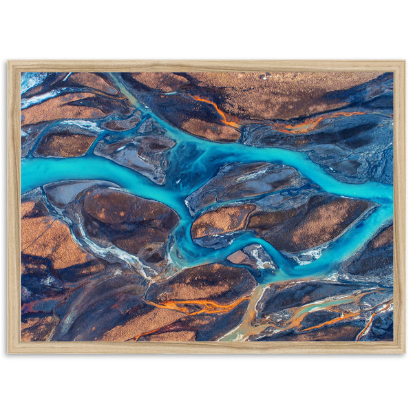 an aerial view of a river and land