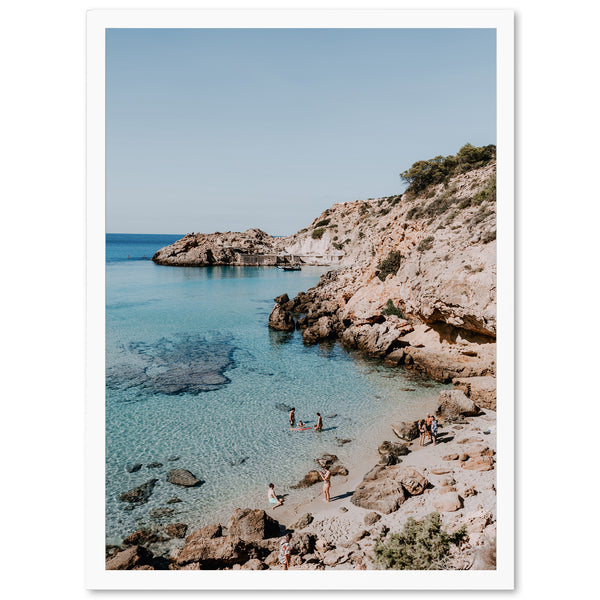 a picture of a beach with people swimming in the water