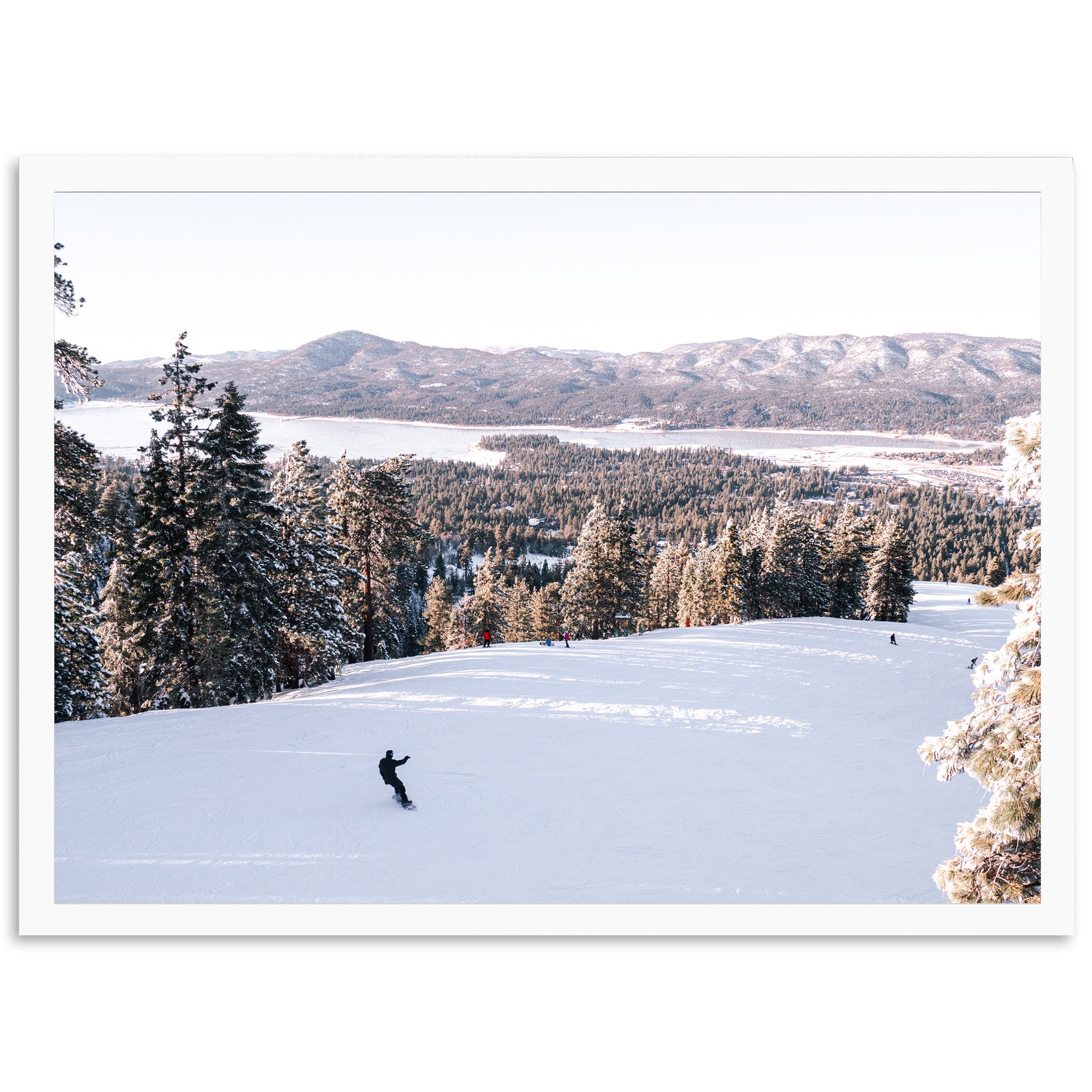 a person riding skis on top of a snow covered slope