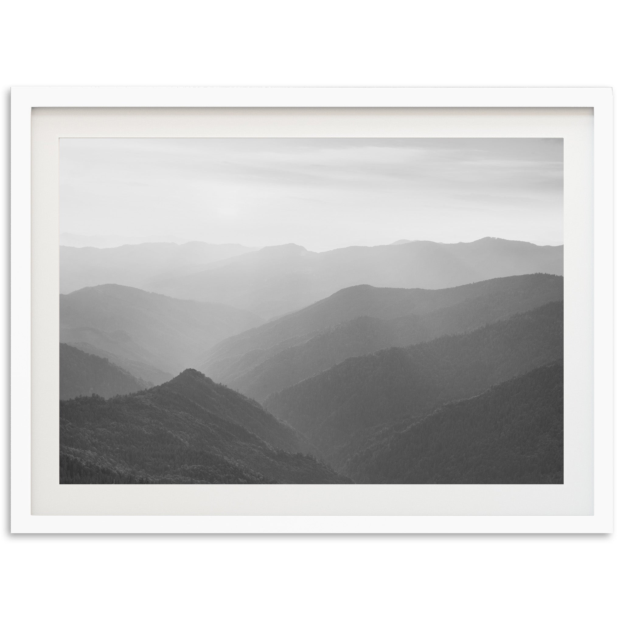 a black and white photo of a mountain range