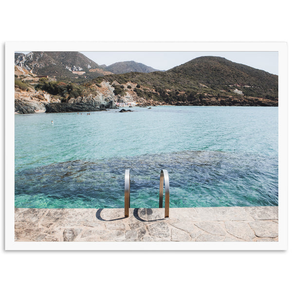 a picture of a body of water with mountains in the background