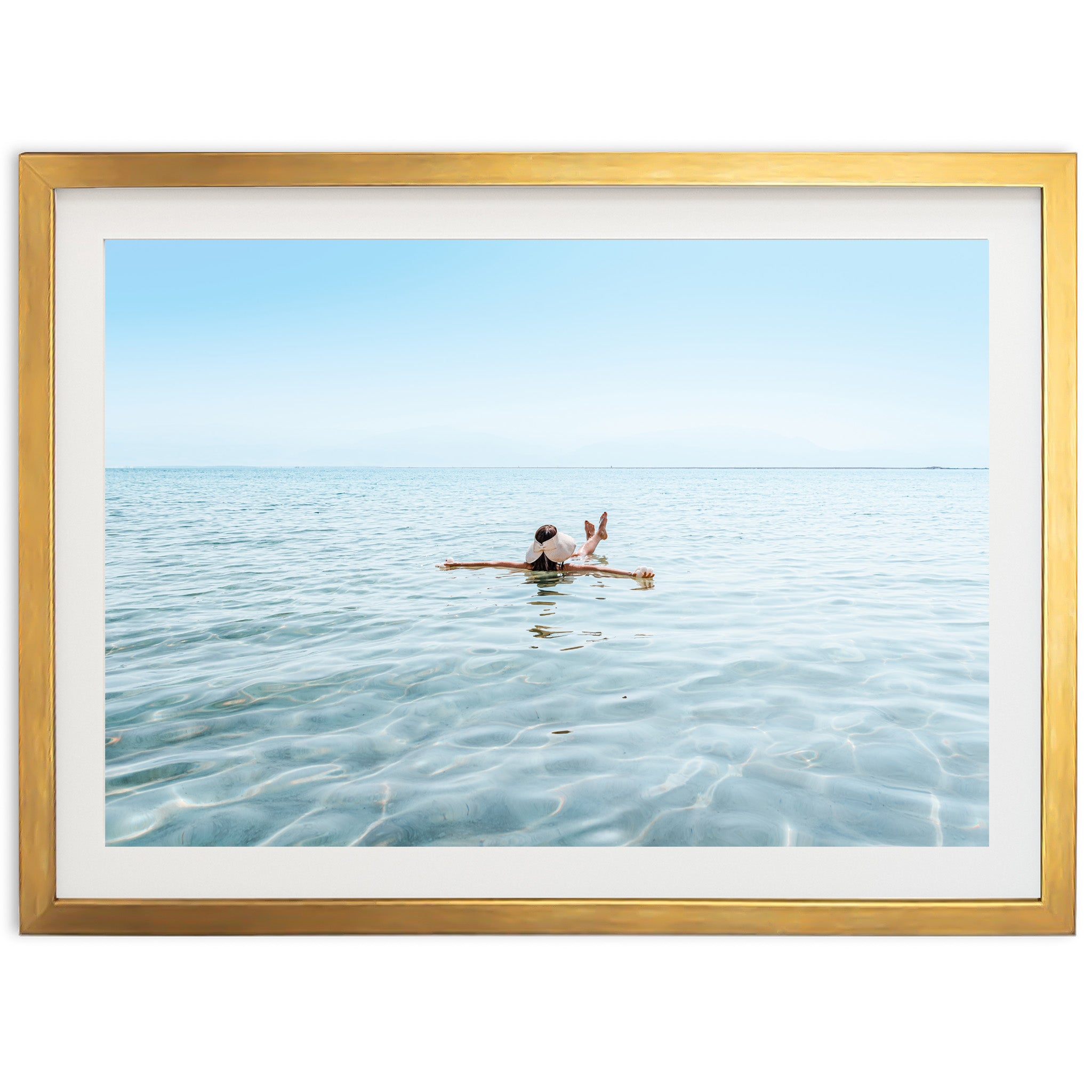 a person sitting on a surfboard in the ocean