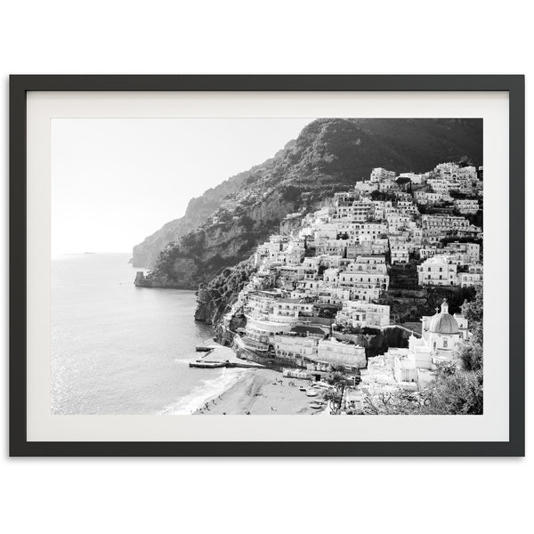 a black and white photo of a village on a cliff