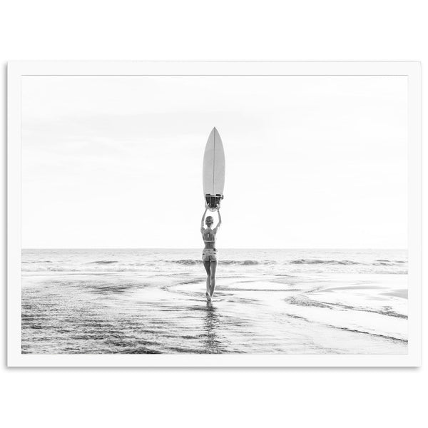 a person holding a surfboard on top of a body of water