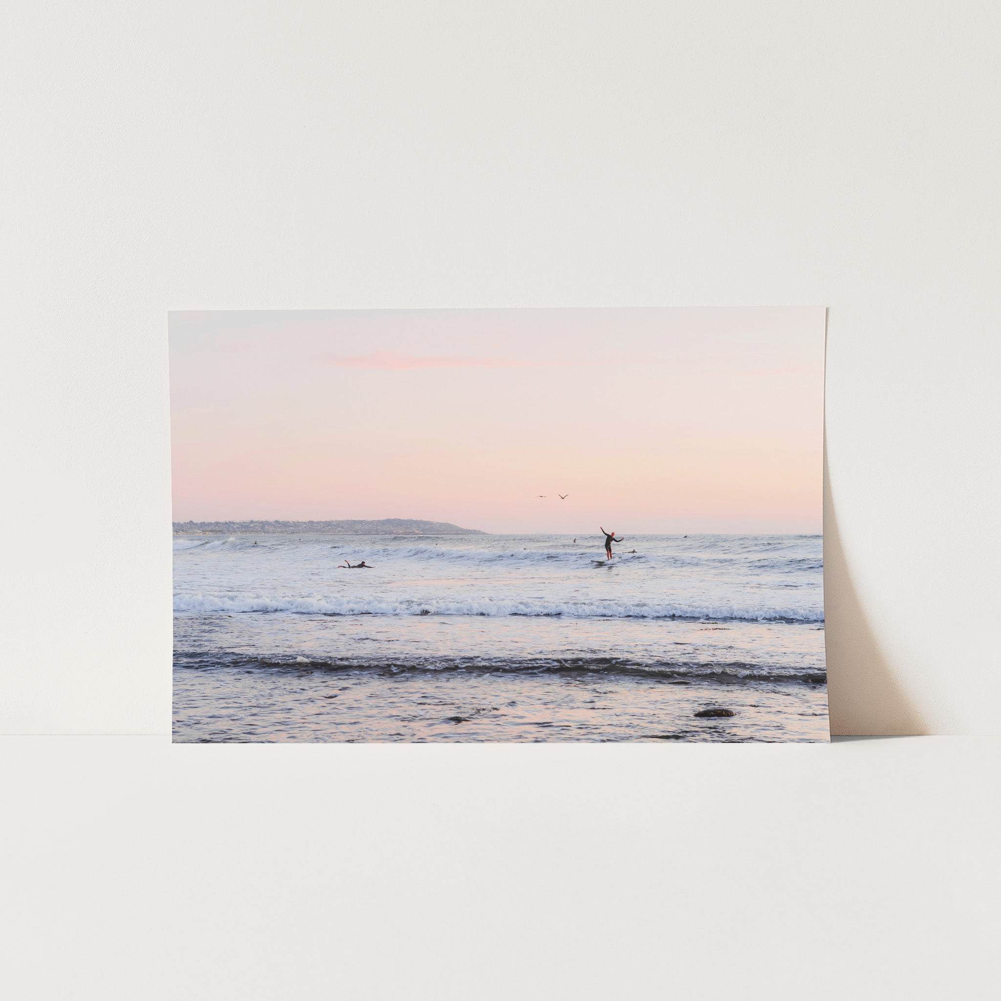 a picture of a person on a surfboard in the ocean