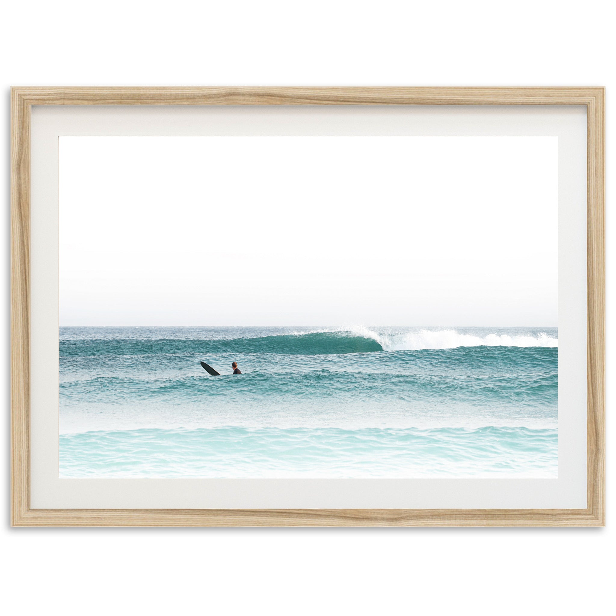 a person riding a surfboard on a wave in the ocean