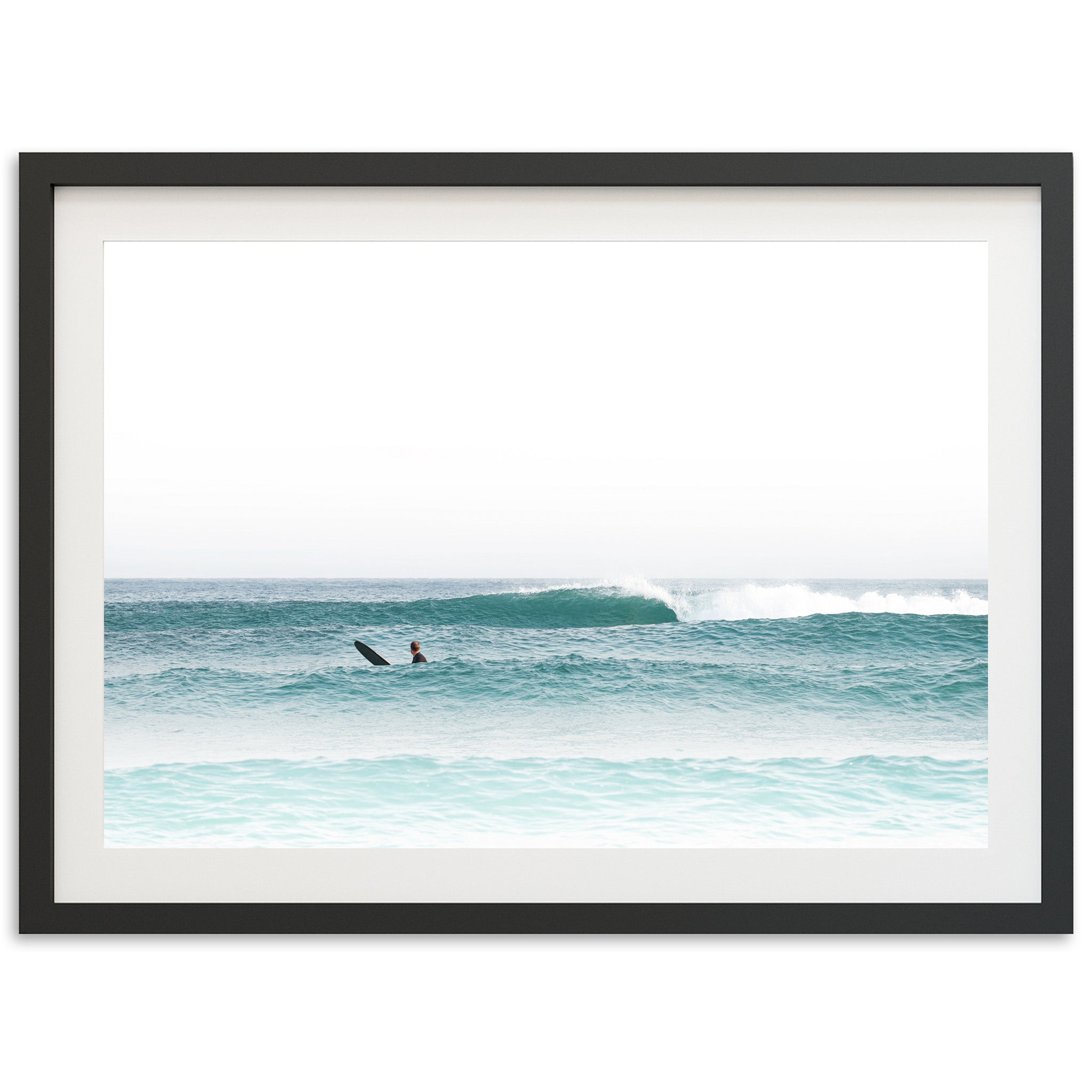 a person riding a surfboard on a wave in the ocean