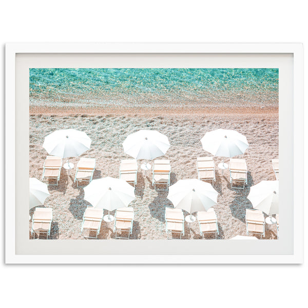 a group of chairs and umbrellas on a beach