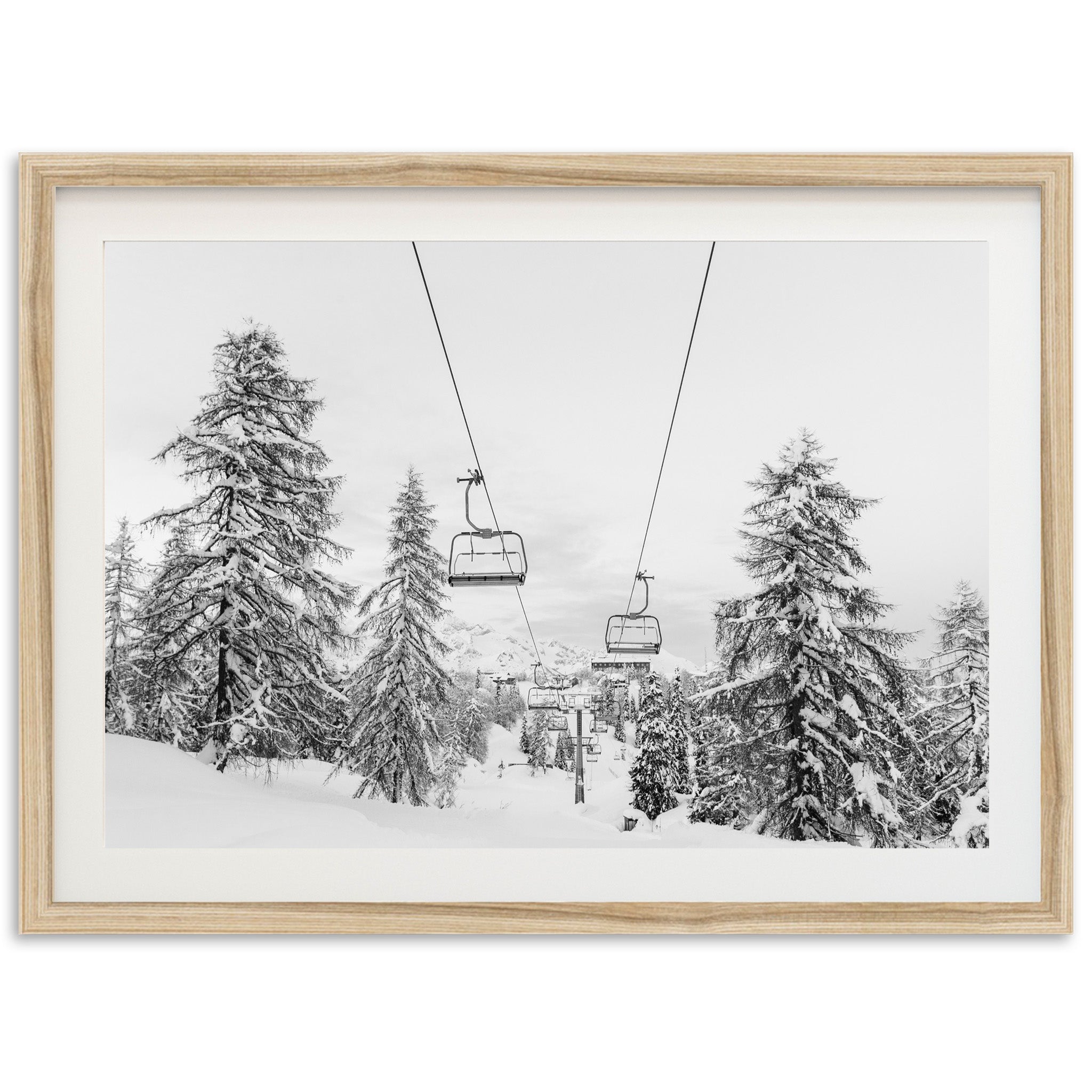 a black and white photo of a ski lift