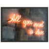 a neon sign that says all you need is love