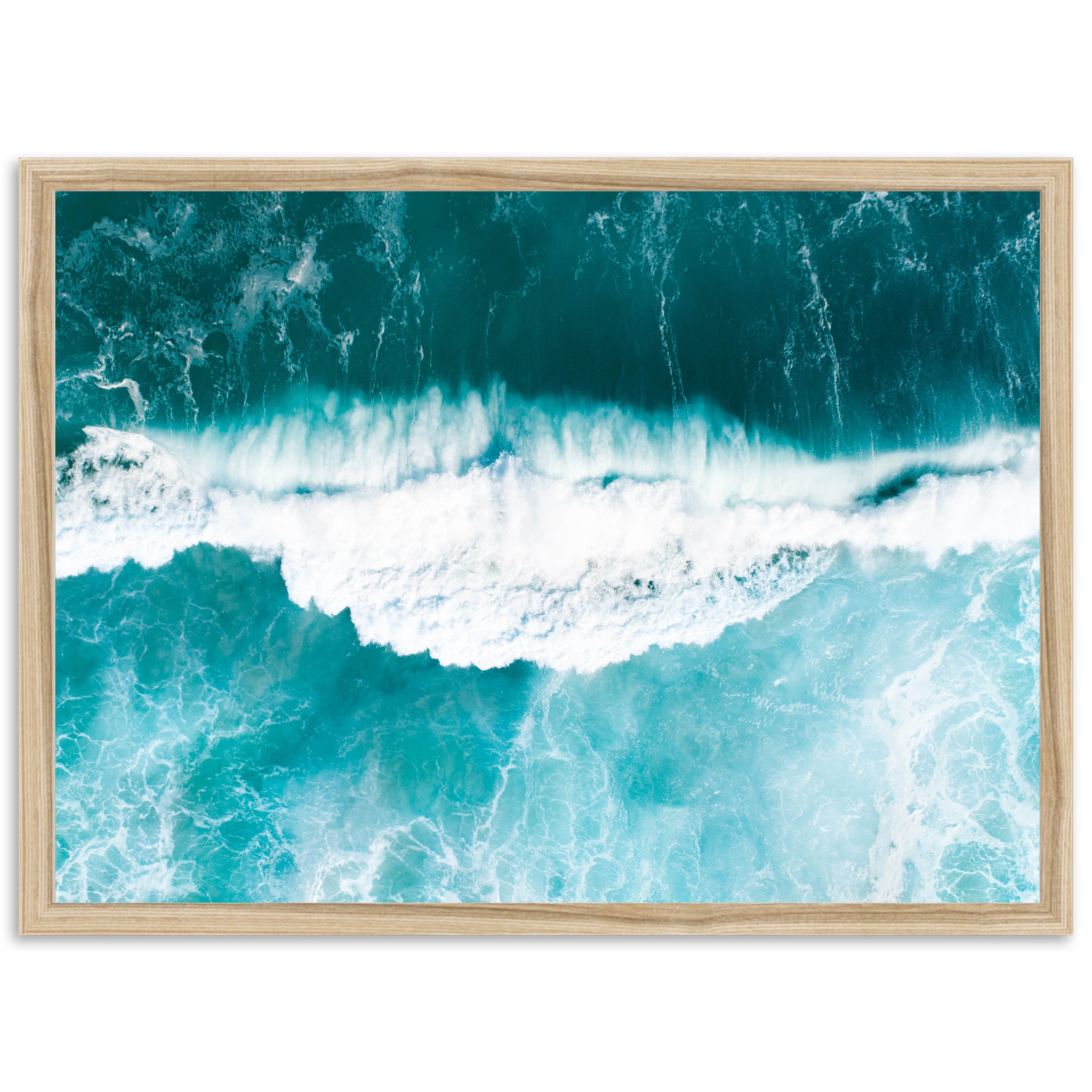 an aerial view of a blue ocean with waves