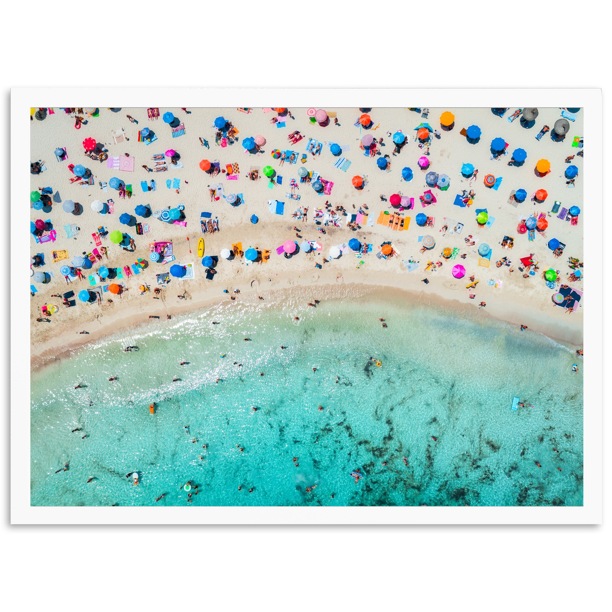 an aerial view of a beach with umbrellas