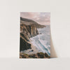 a picture of a beach with a cliff in the background