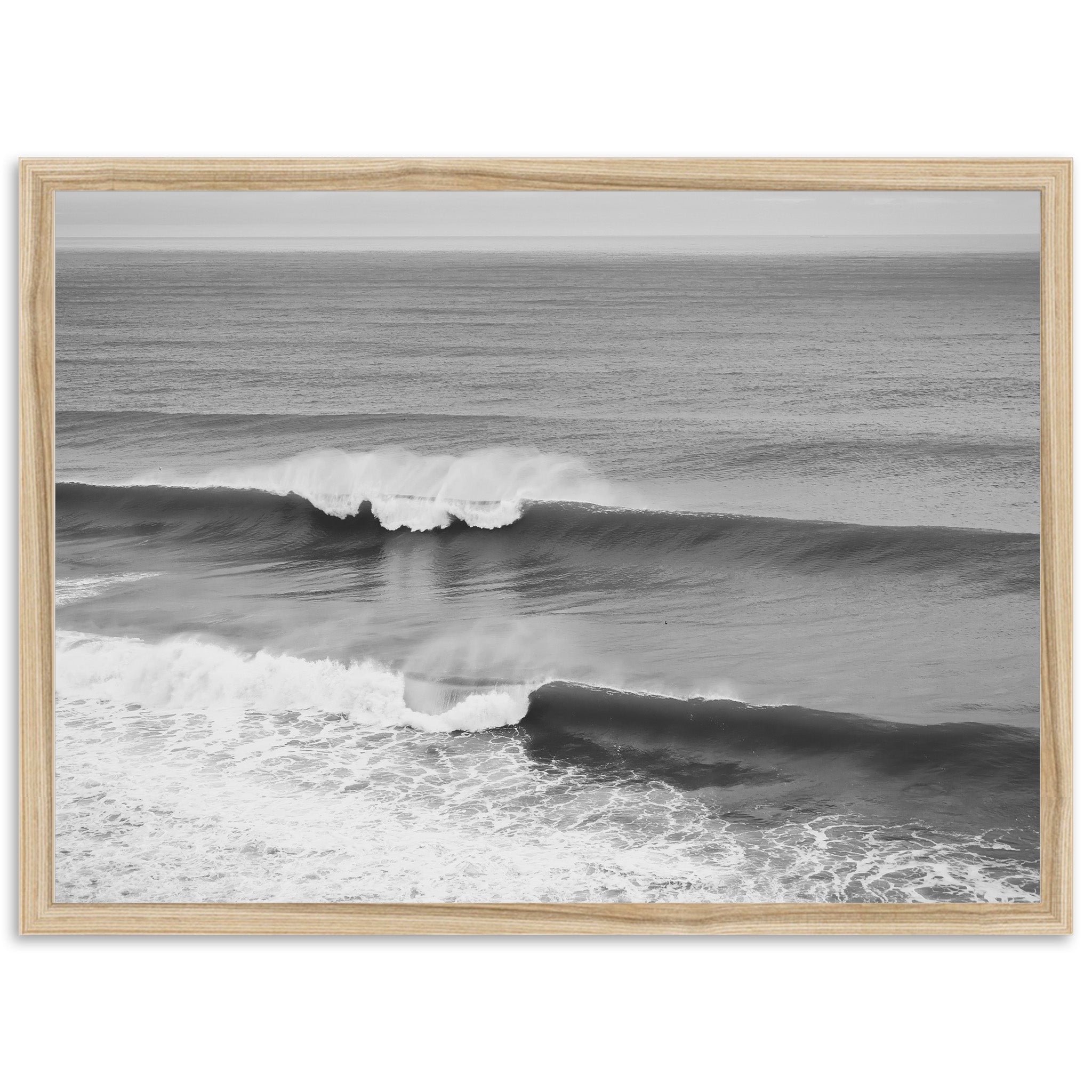 a black and white photo of a wave in the ocean