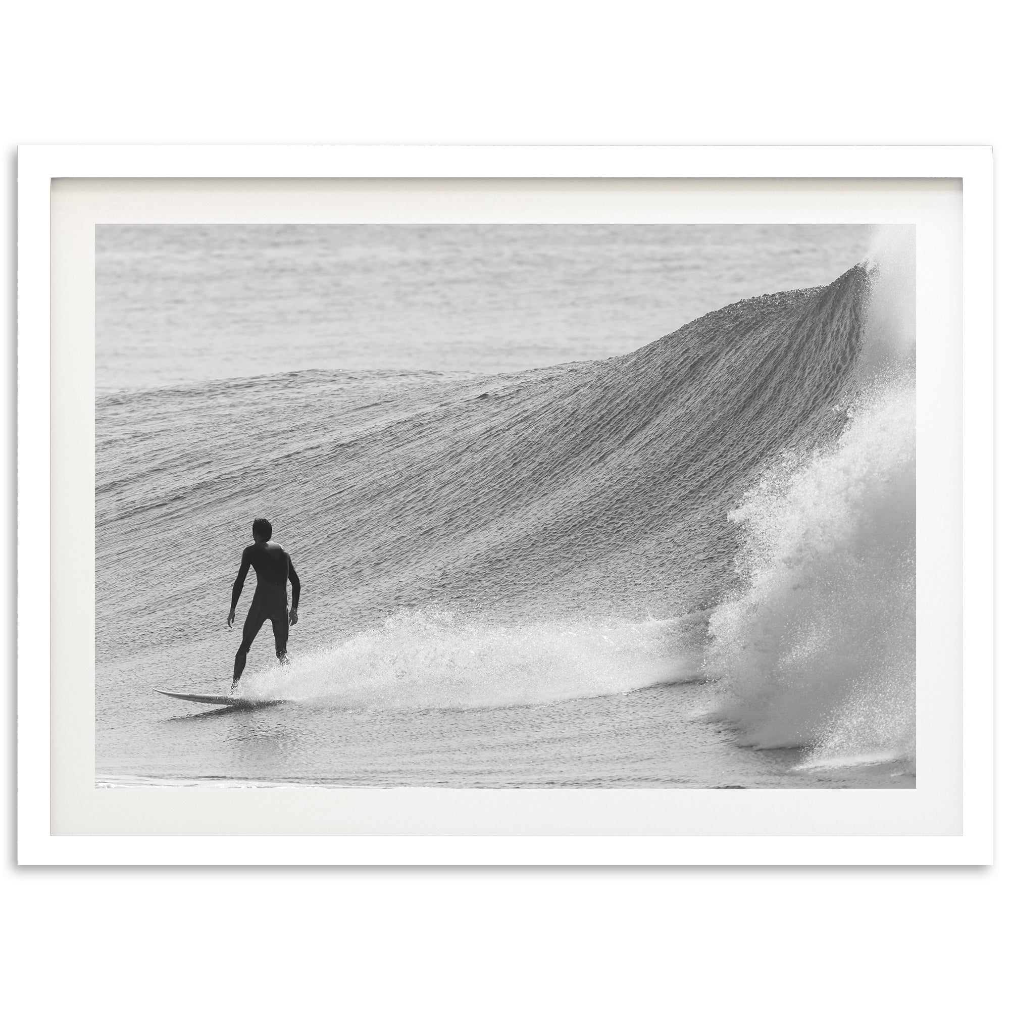 a man riding a wave on top of a surfboard