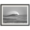 a black and white photo of a wave in the ocean