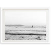 a black and white photo of a person on a surfboard