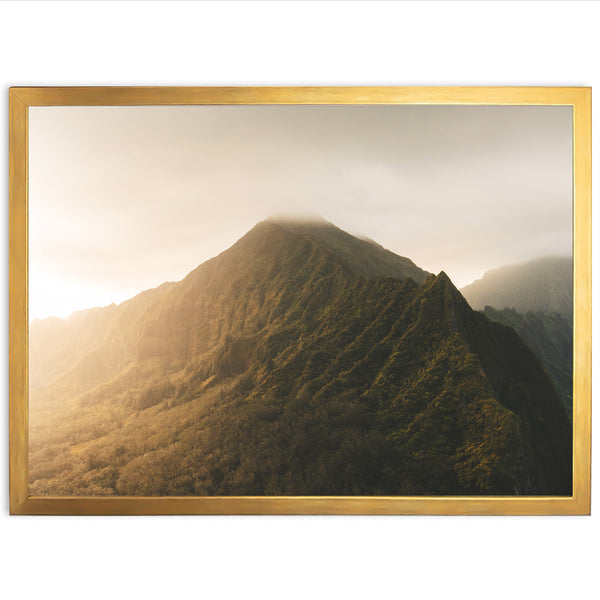 a picture of a mountain with a golden frame