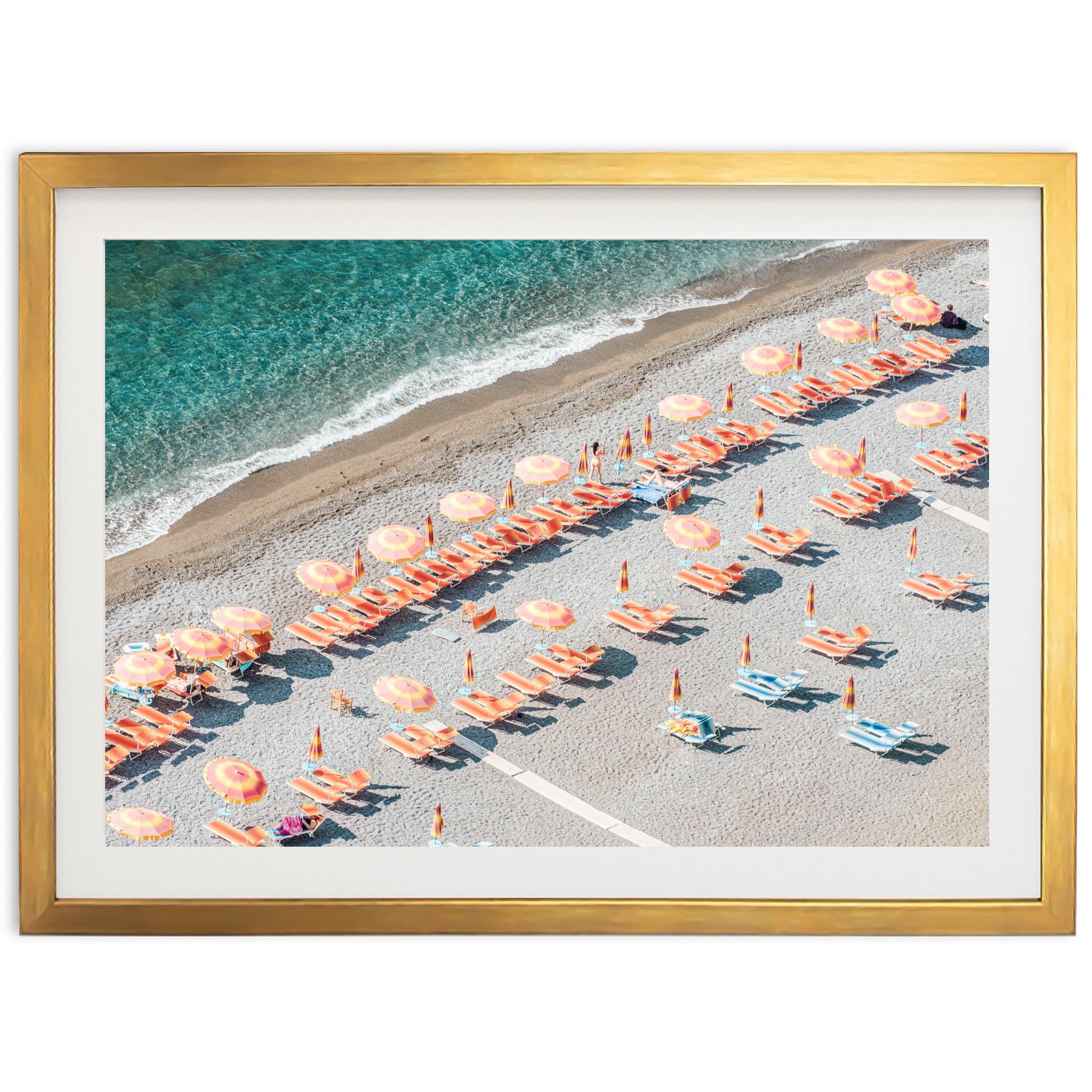 an aerial view of a beach with umbrellas and chairs