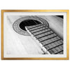 a black and white photo of an acoustic guitar