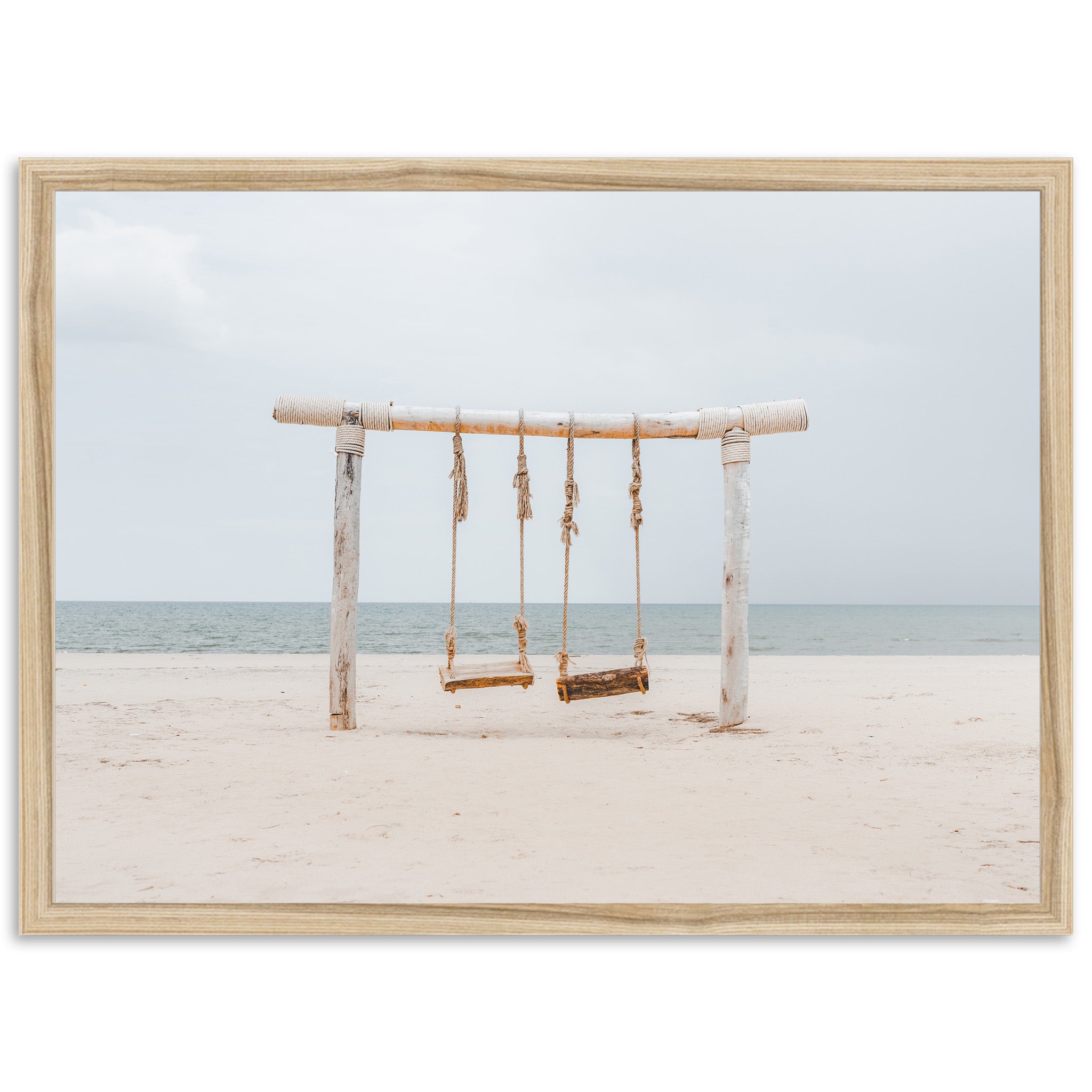 a picture of a swing set on a beach