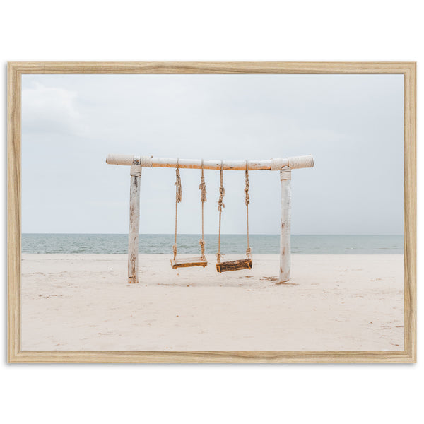 a picture of a swing set on a beach