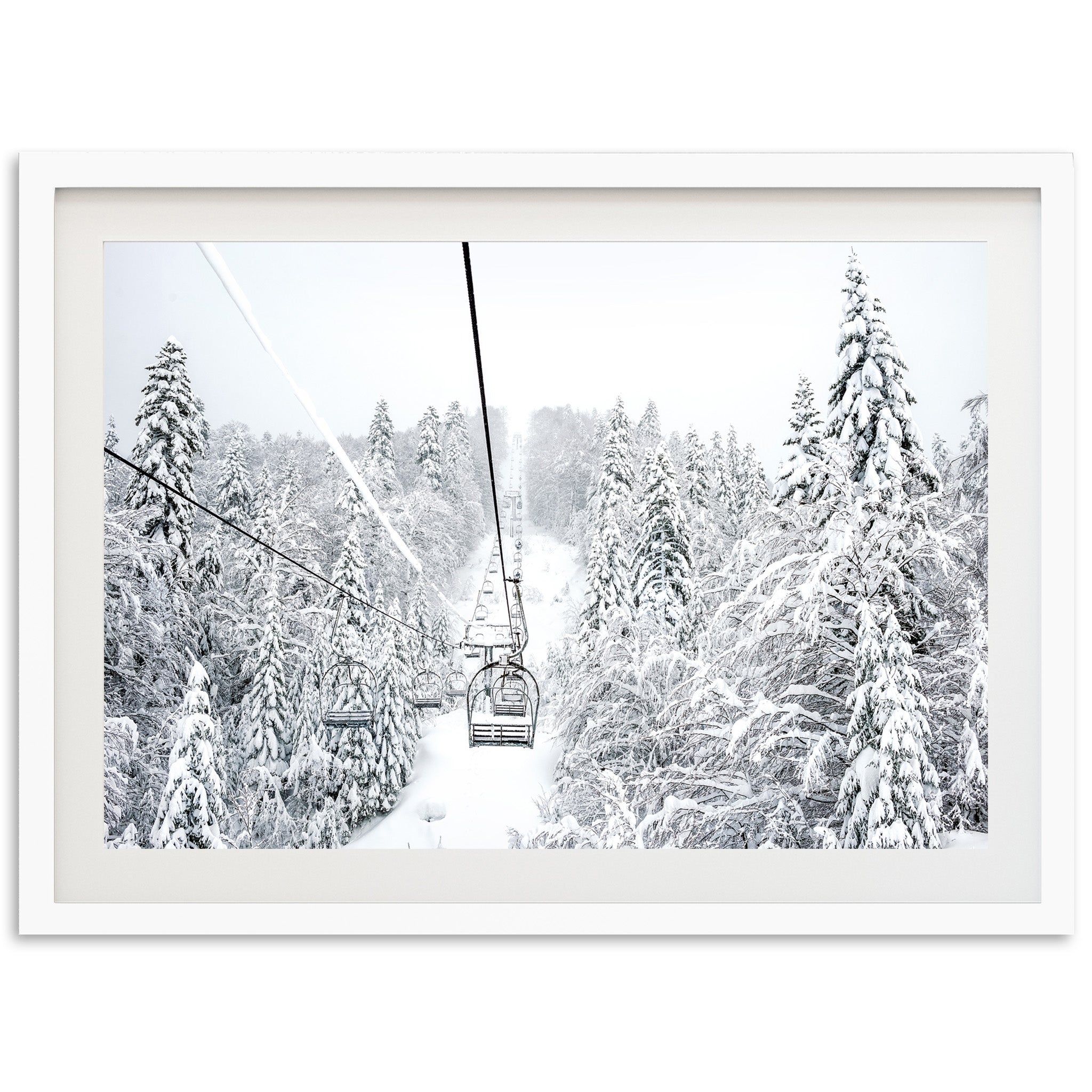 a black and white photo of a ski lift