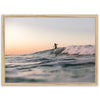 a man riding a wave on top of a surfboard