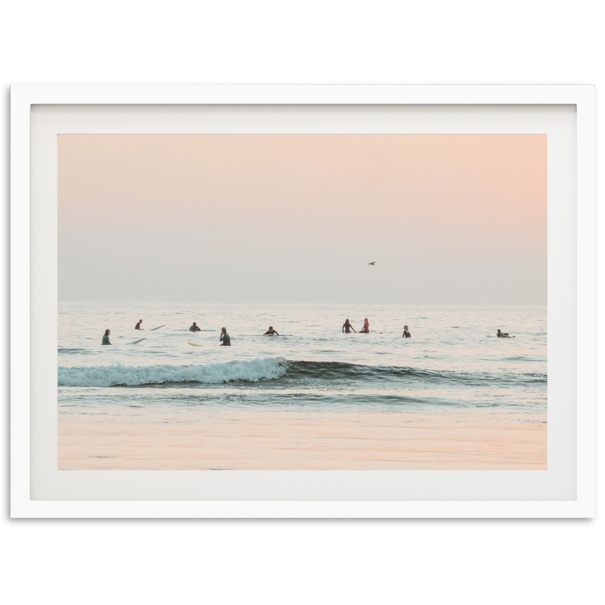 a group of people riding surfboards on top of a wave