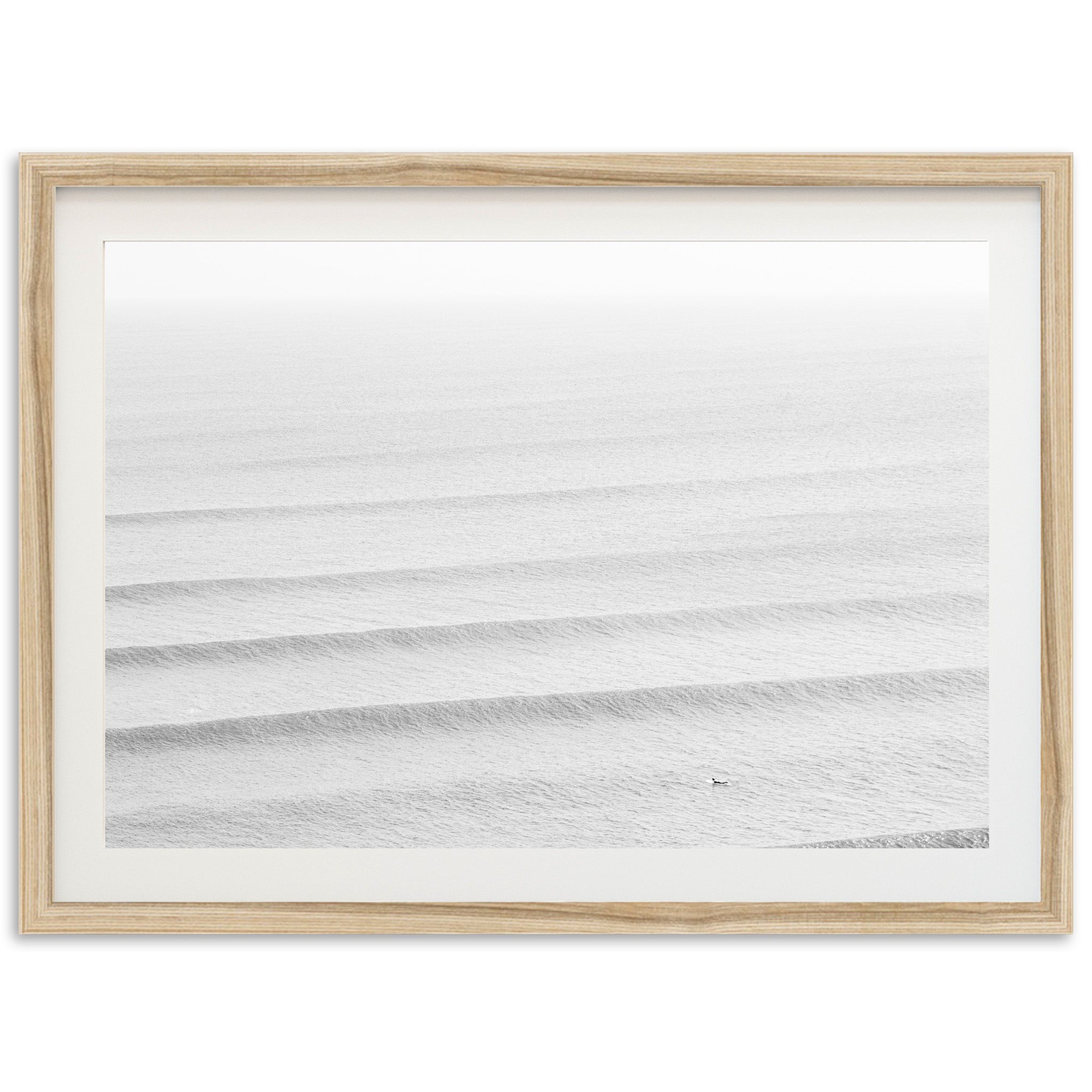 a picture of the ocean in a wooden frame